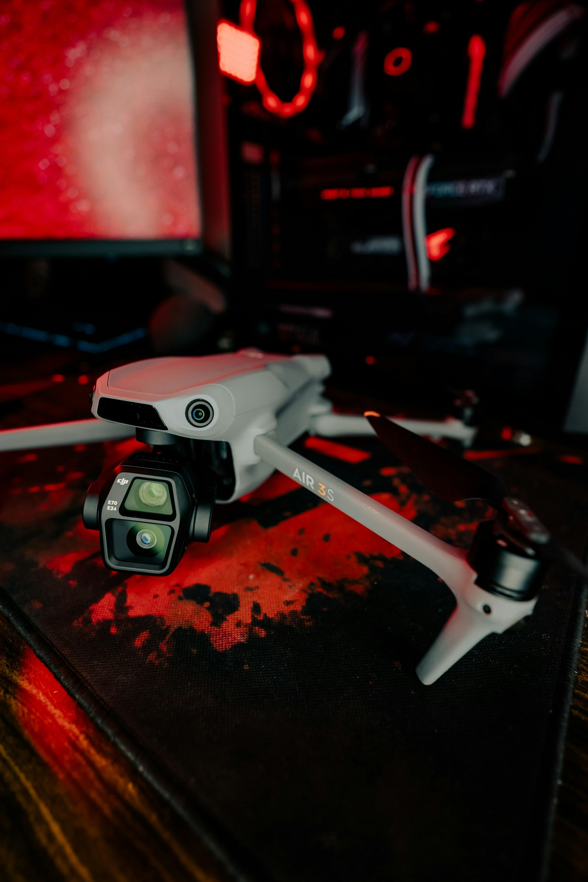 A drone flying over a party at sunset, capturing an aerial view.